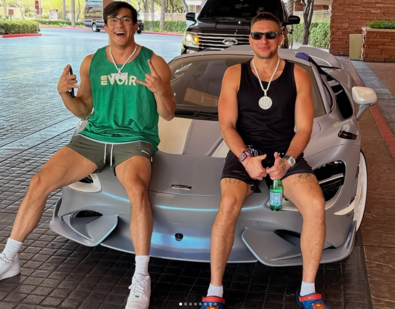 TOGSTER posing on a McLaren with a friend