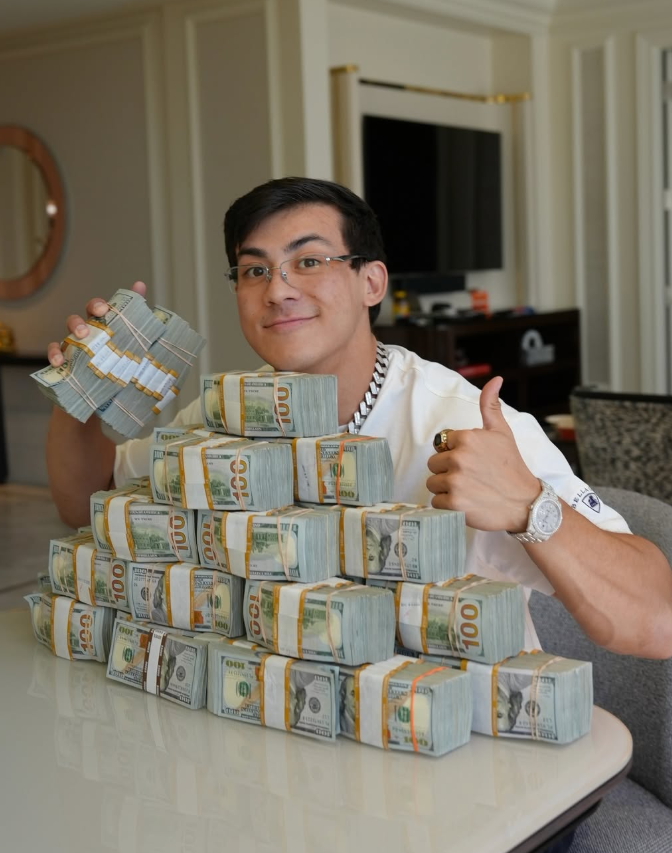TOGSTER with a stack of cash ready to give away